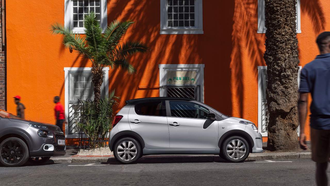 Citroen C1 parked side angle orange wall