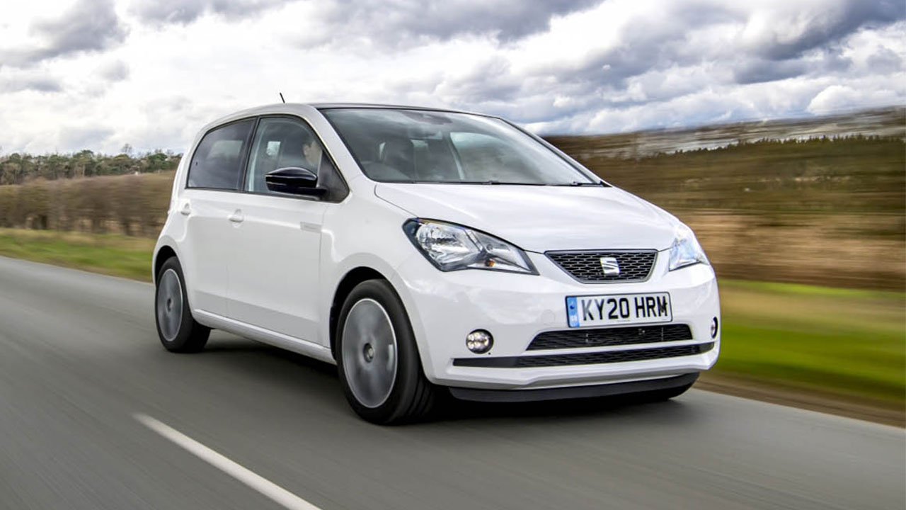 White SEAT Mii, driving in countryside