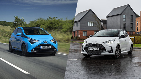 Blue Toyota Aygo Driving Countryside and White Toyota Yaris Static Outside House