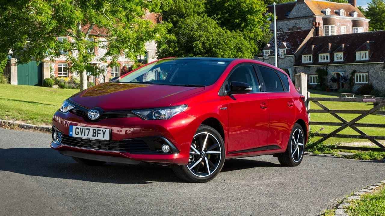 Red Toyota Auris in the country side