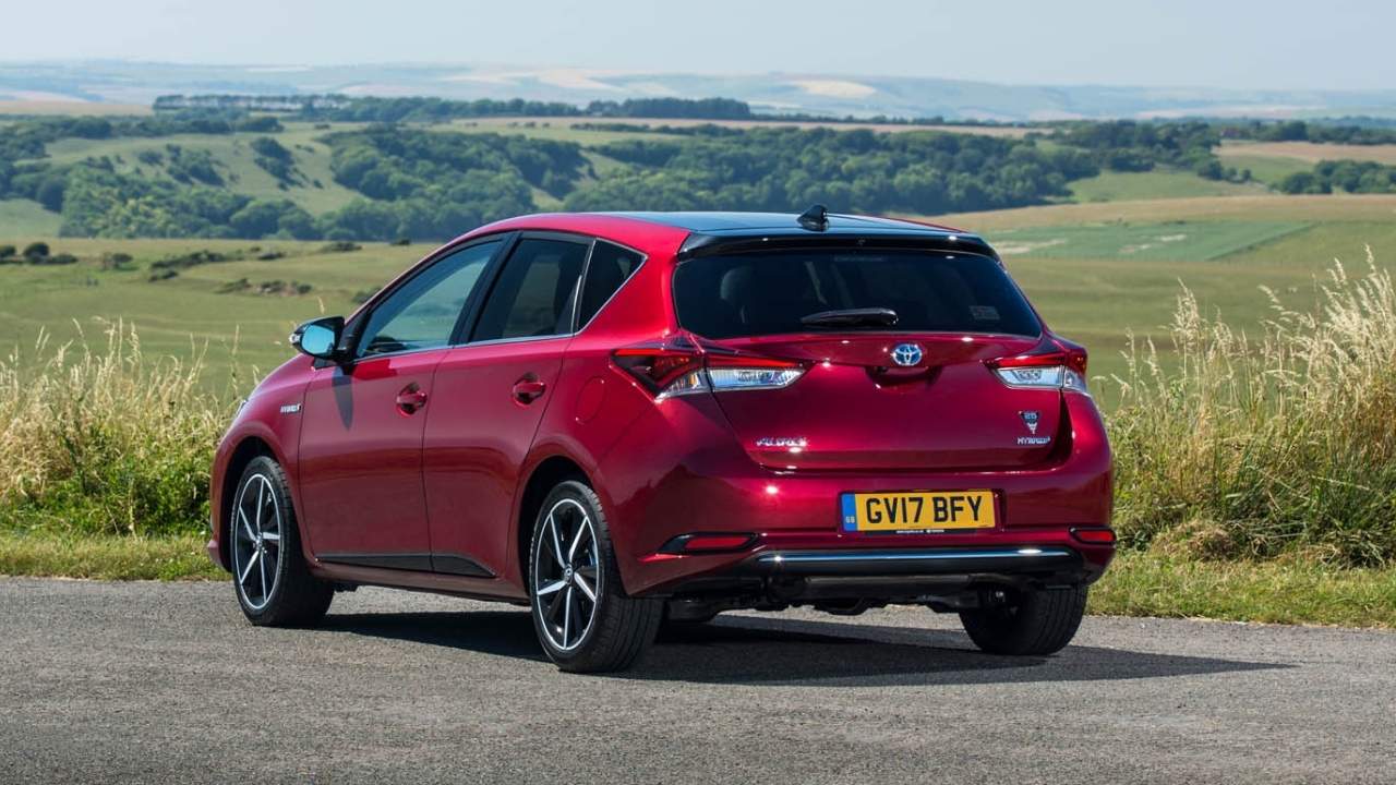 Red Toyota Corolla in the country side