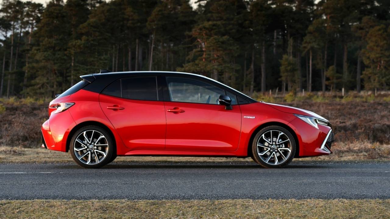 Red Toyota Corolla in the country side