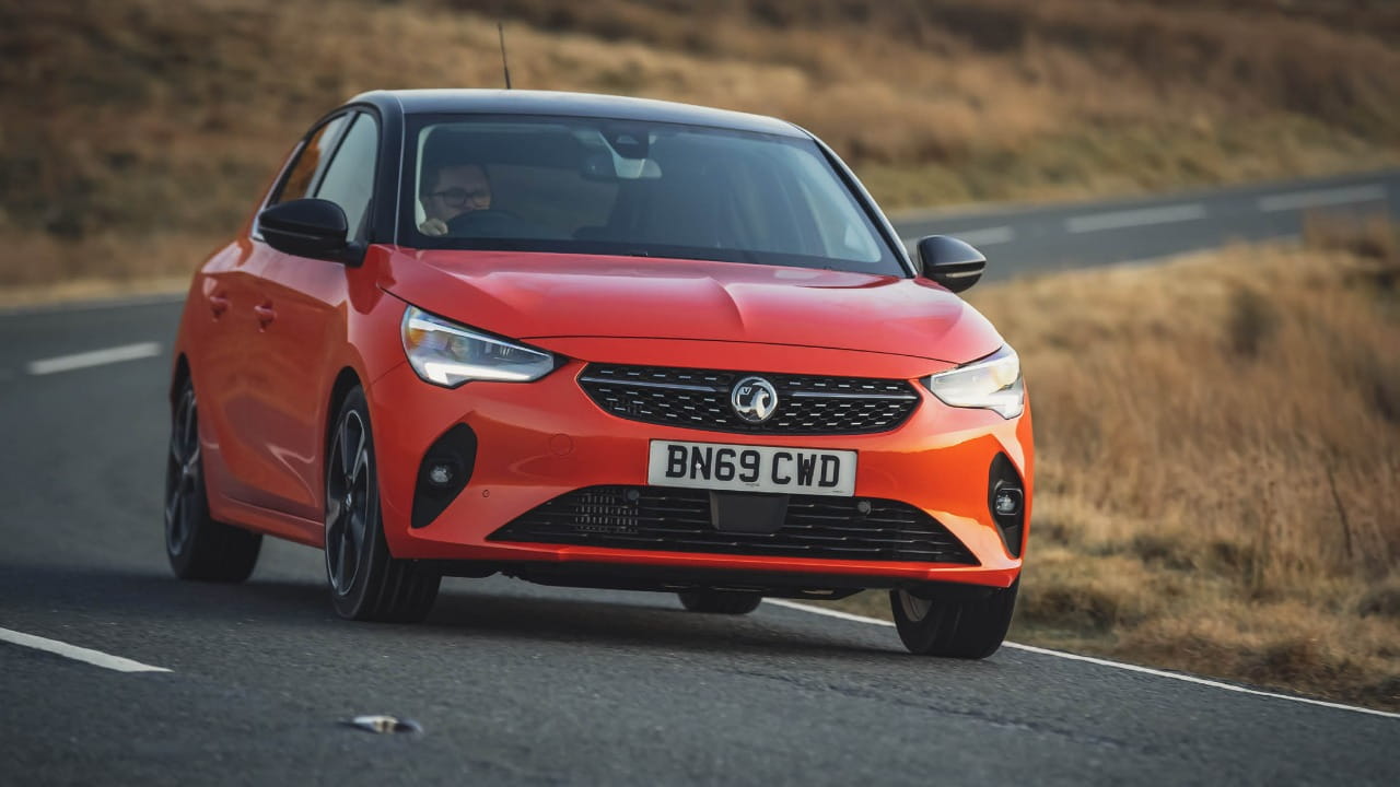 Red Vauxhall Corsa Driving Front