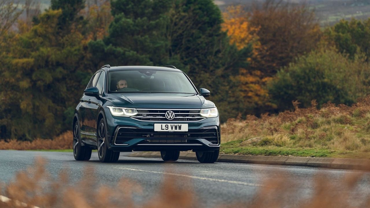 Dark blue Volkswagen Tiguan driving in the country side