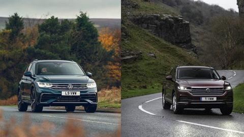 Dark blue Volkswagen Tiguan and burgundy Volkswagen Touareg driving in the country side