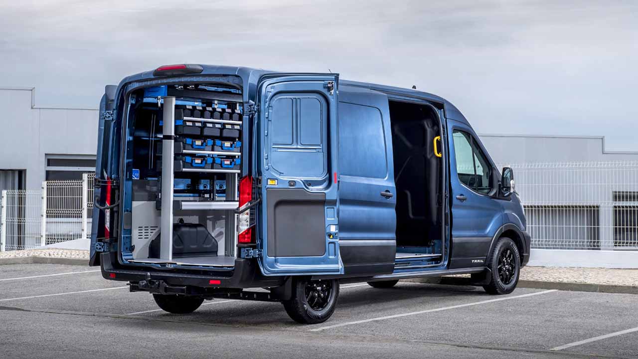 Blue Ford Transit, rear quarter shot, cargo area full