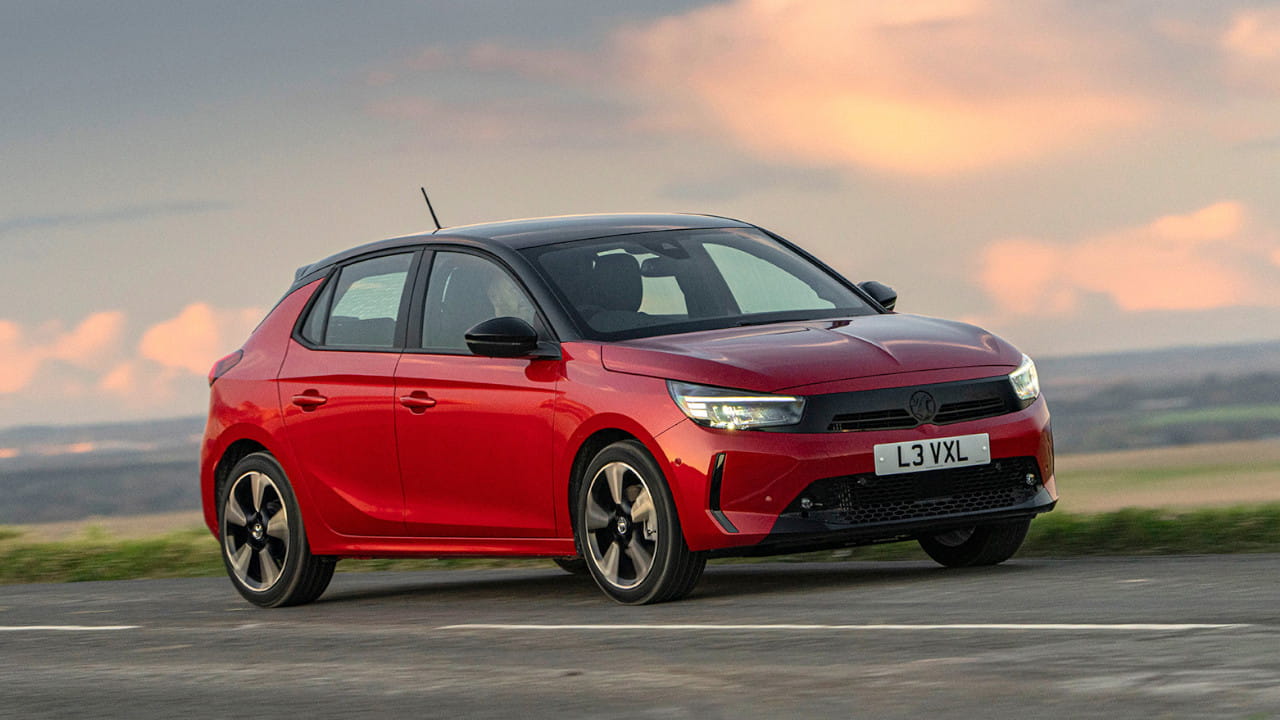 Red Vauxhall Corsa Driving