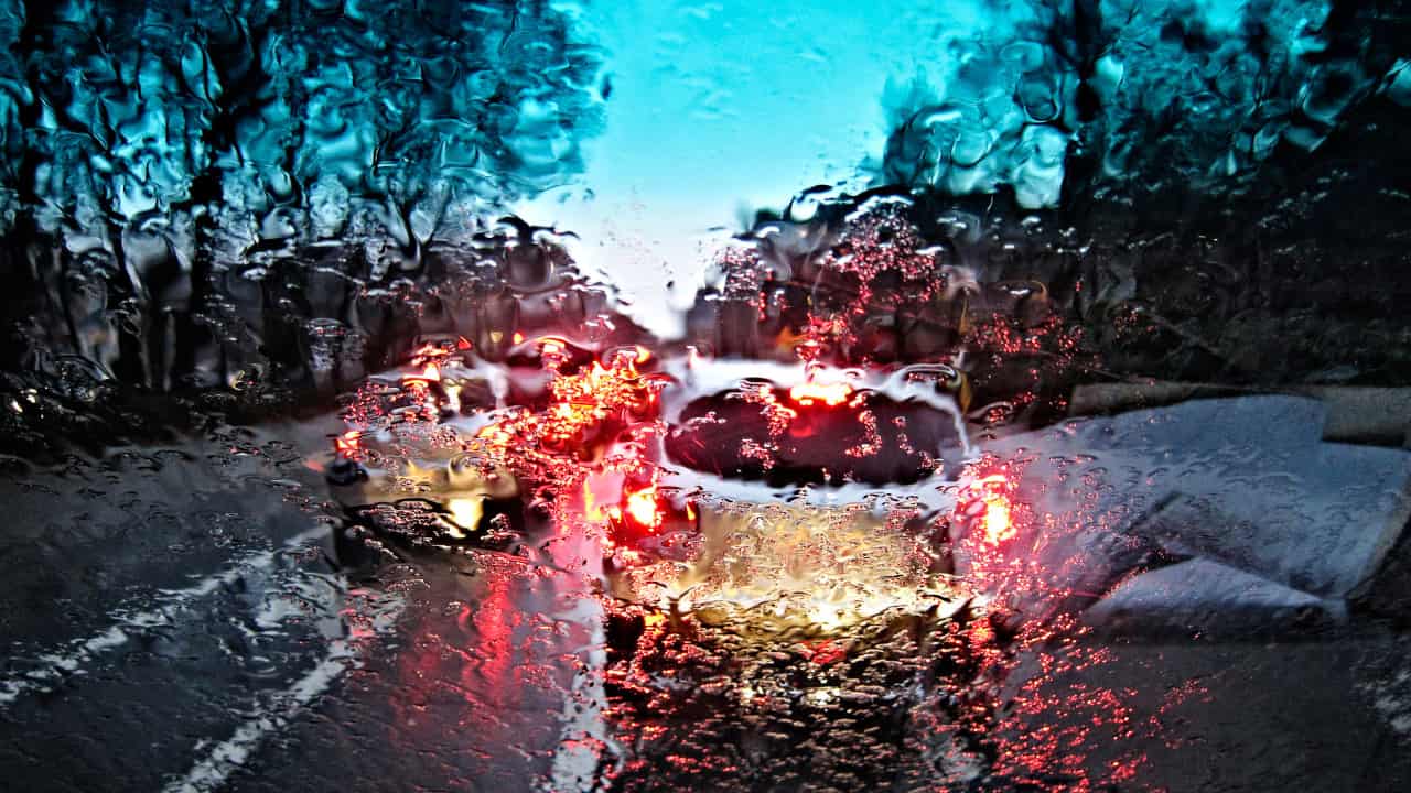 Car Driving Through Rain