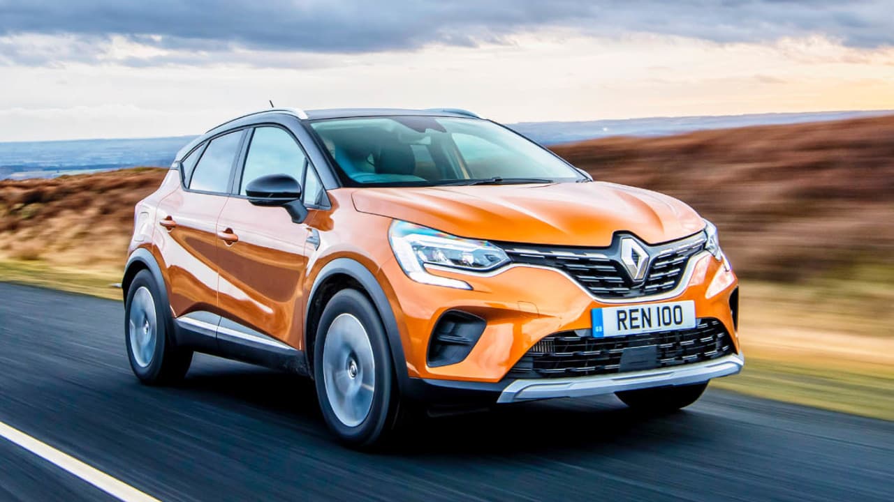 Orange Renault Captur Driving On Road
