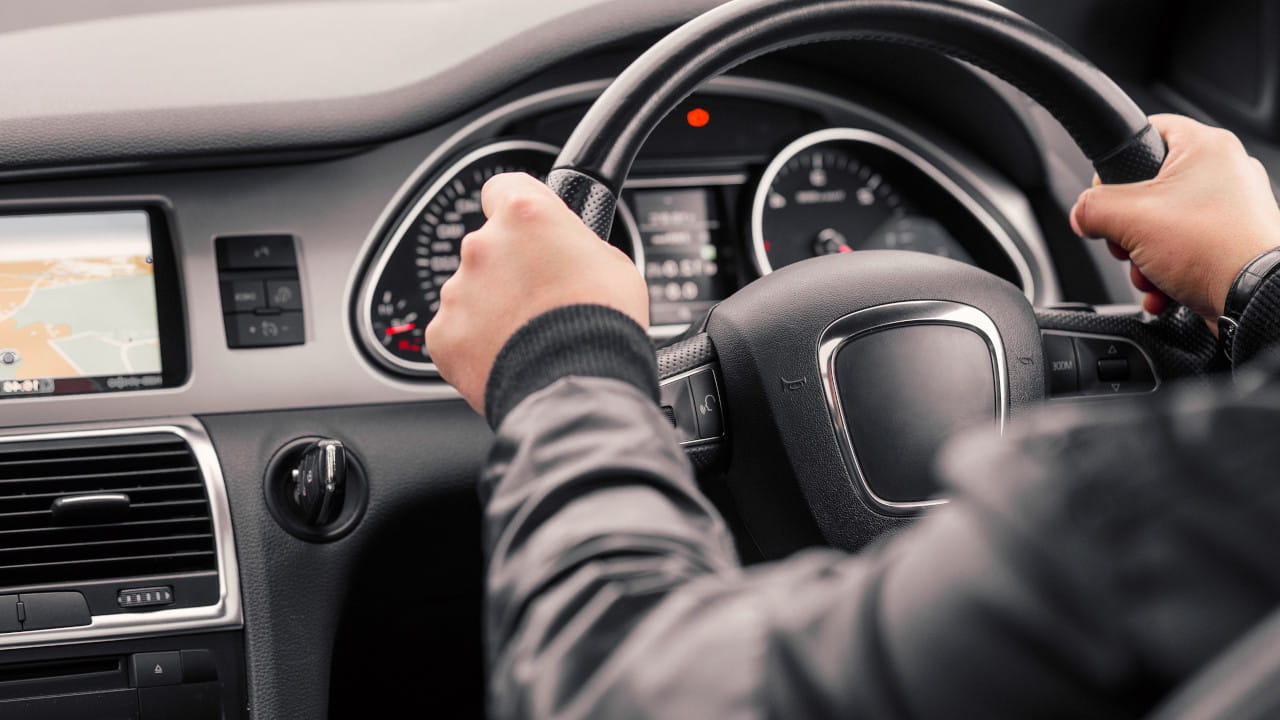 Hands On Steering Wheel Of Car