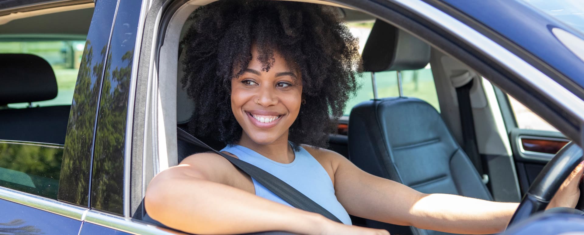 Woman Sitting In Car With Window Down