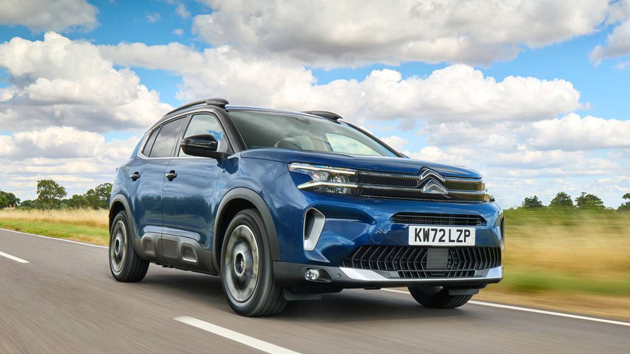 Blue Citroen C5 Electric driving in the country side