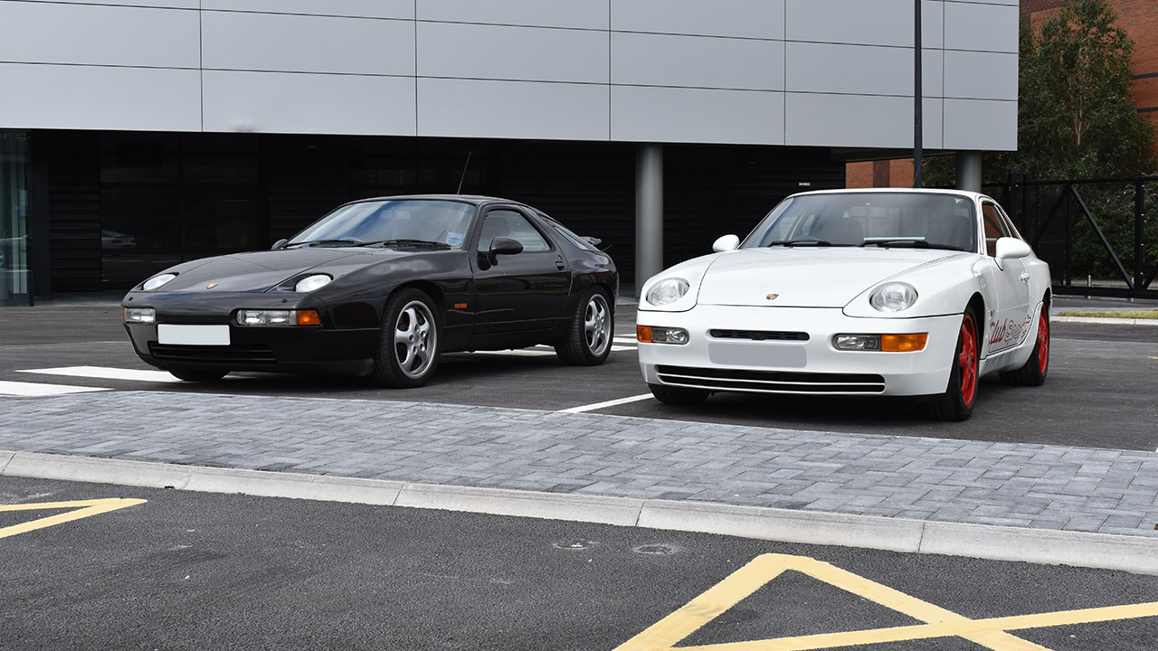 Classic Porsches parked next to each other