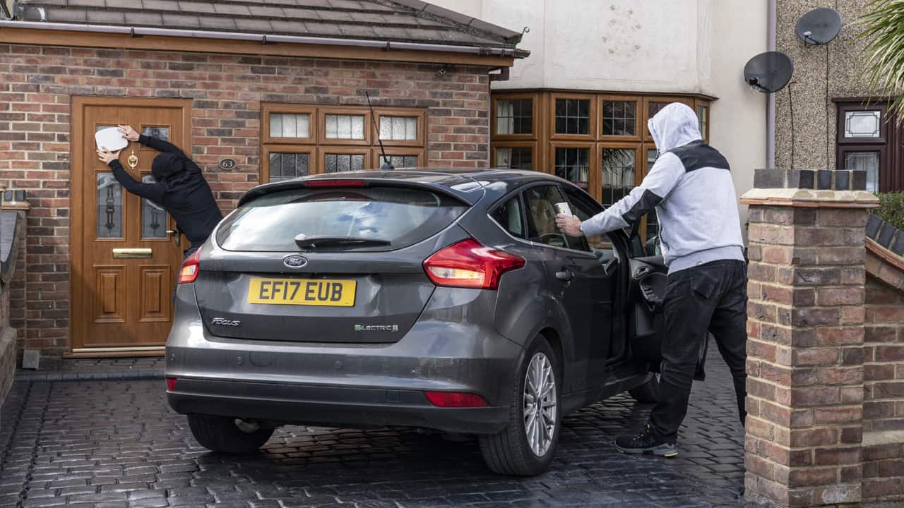 Thieves Breaking Into Car