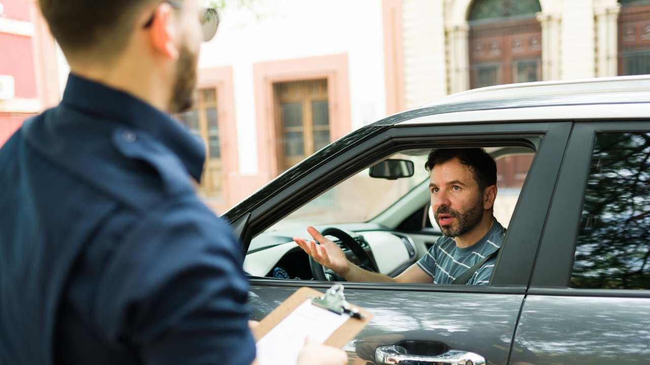 Police officer fining a man
