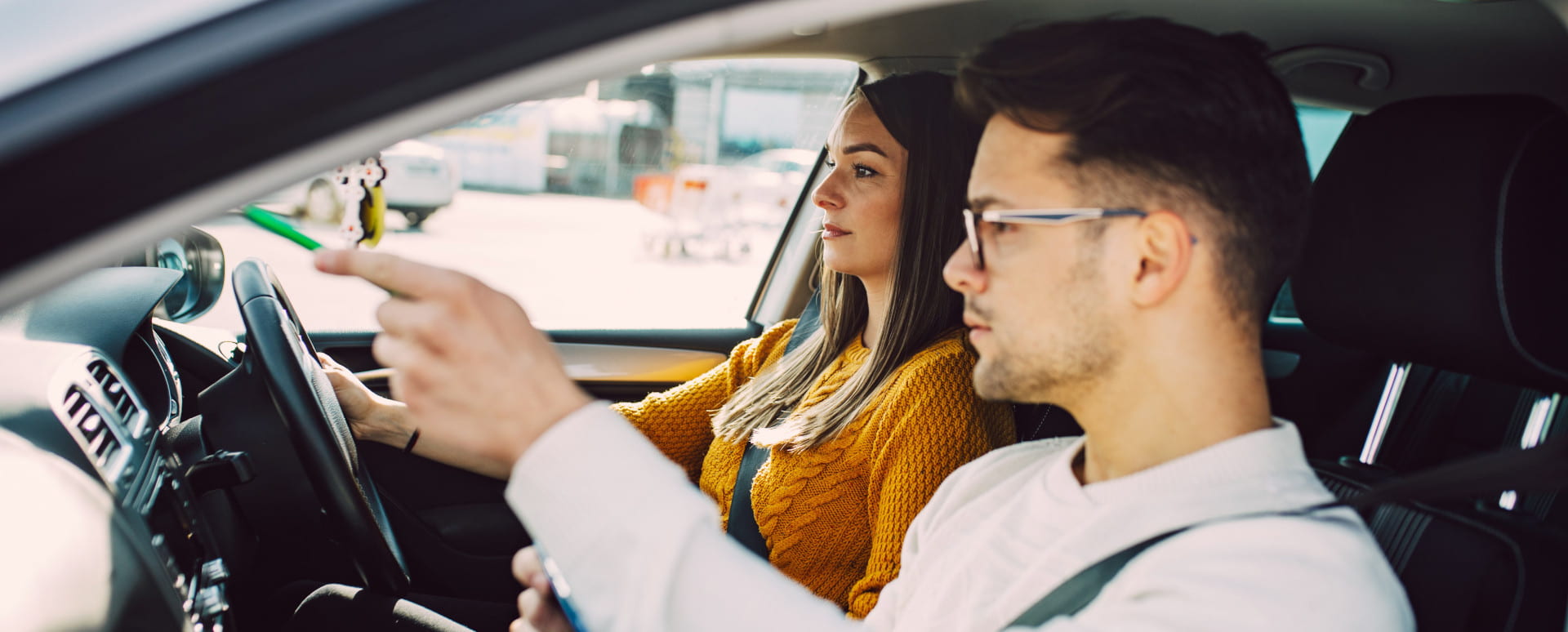 Woman Driving Car With Man in the Passenger Seat