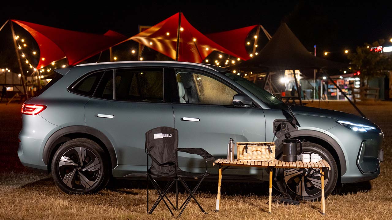 Geely EX5 side with table and camping gear