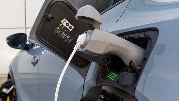 V2L Charger plugged into grey car