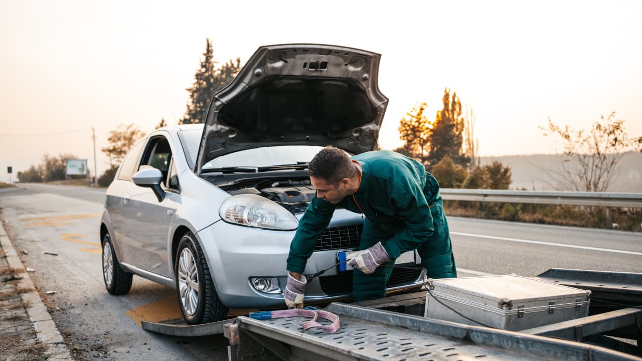 Car Being Recovered on Flat Bed Truck