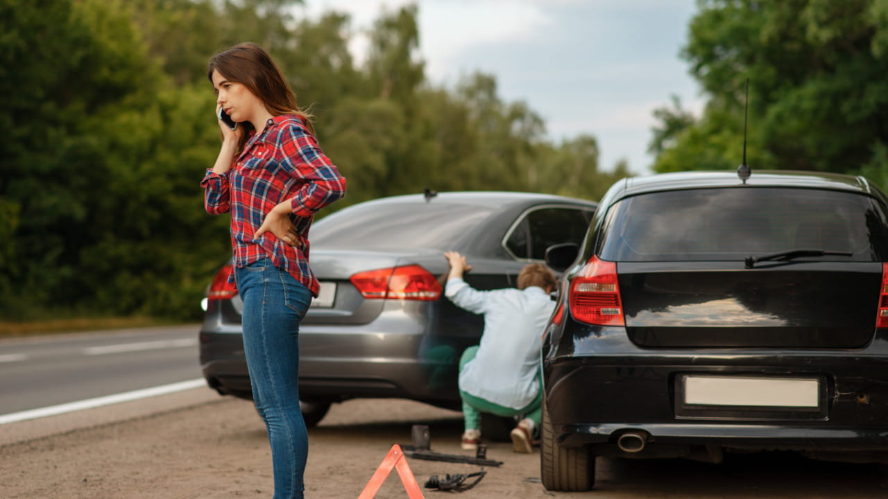 Man and Woman Following Car Accident