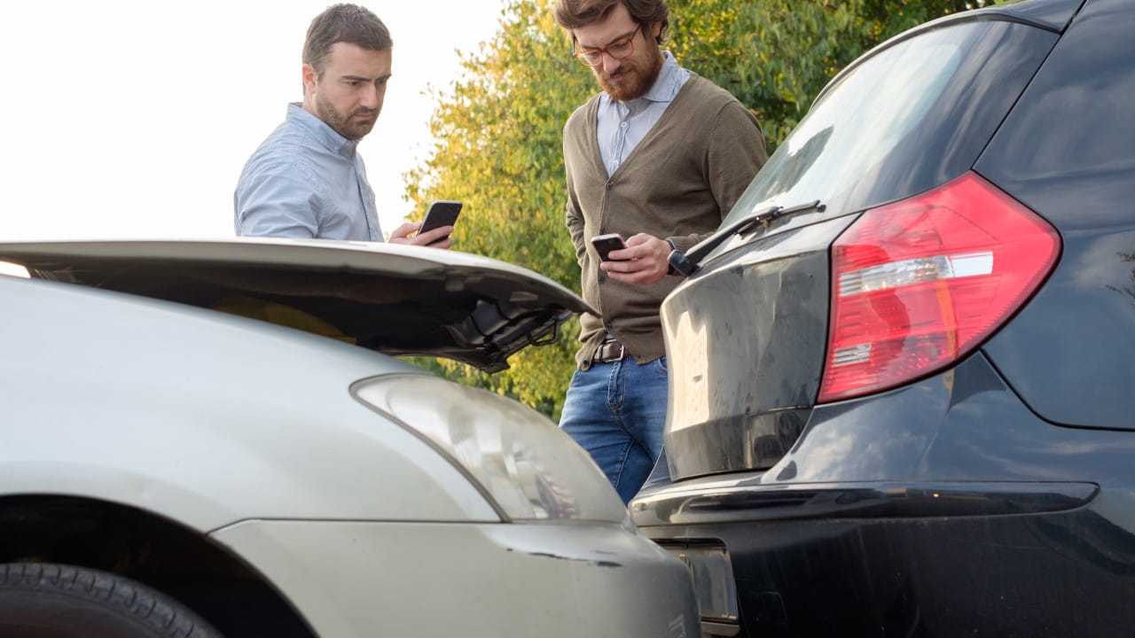 Two Men Exchanging Insurance Details