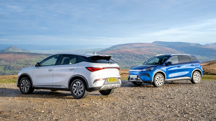 BYD ATTO 3 EVO Blue and White pair mountain background