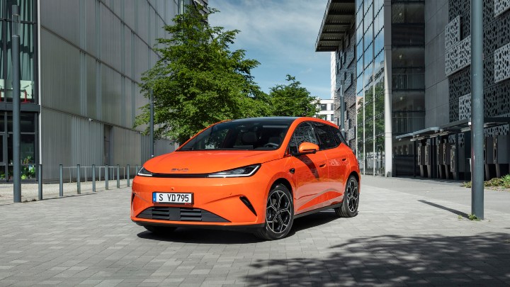 Orange BYD Dolphin G Exterior Front in Urban Area