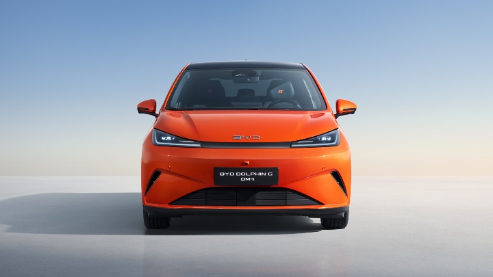 BYD Dolphin G DM‑i front view highlighting LED headlights in studio
