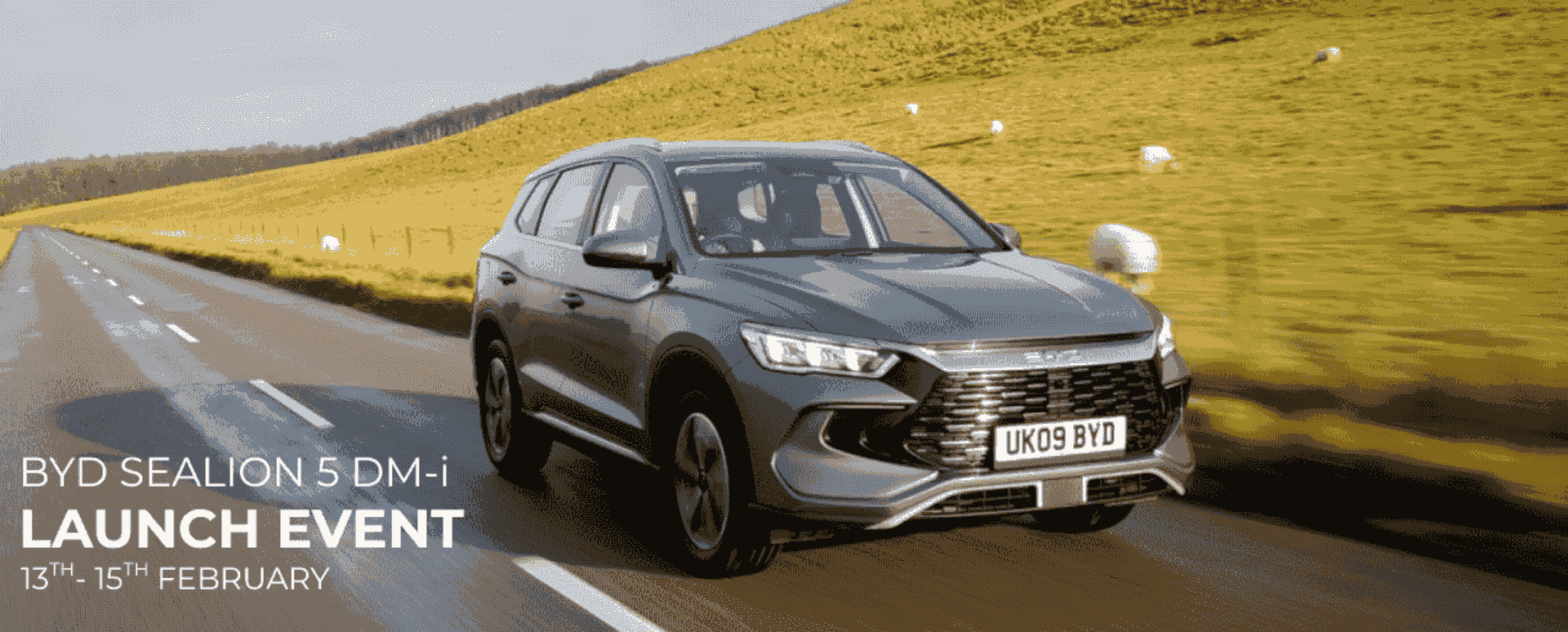 Grey BYD Sealion 5DM-i Driving on Country Road