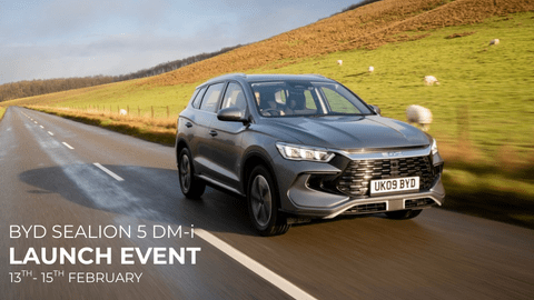 Grey BYD Sealion Driving on Country Road