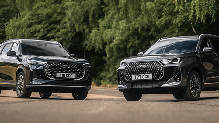Two Black Chery Vehicles Parked in Countryside