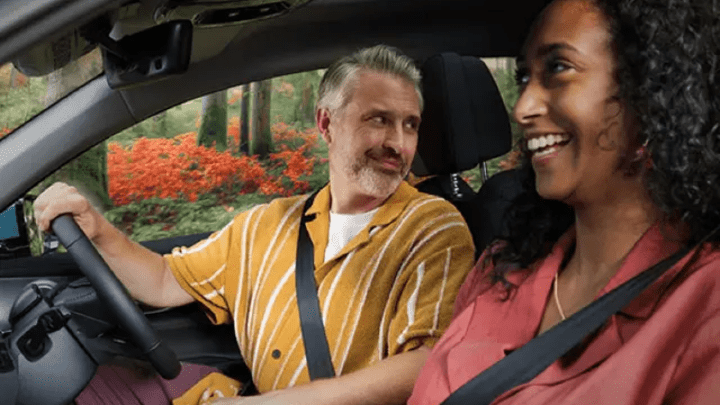 Driver and Passenger Sat Inside Car