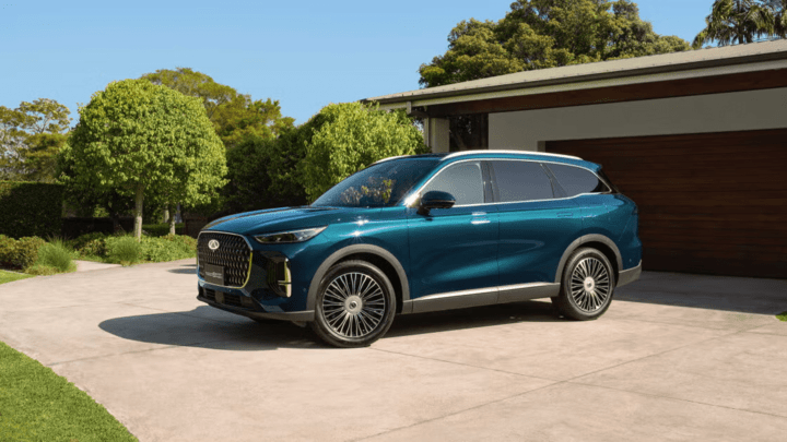 Blue Chery Tiggo 9 Parked on Countryside Driveway 