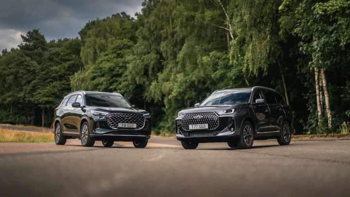 Two Black Chery Tiggo 9 Models Parked on Woodland Road