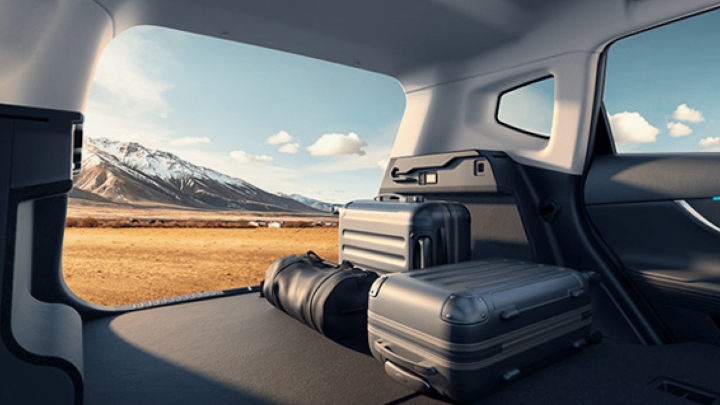 Luggage in Chery Tiggo 7 Boot with Mountainous Backdrop