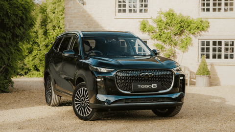 Dark Green Chery Tiggo 8 Parked Outside Country Home