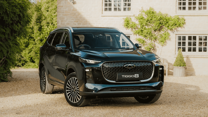 Dark Green Chery Tiggo 8 Parked Outside Country Home