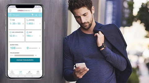 handsome man using the my citroen smartphone application