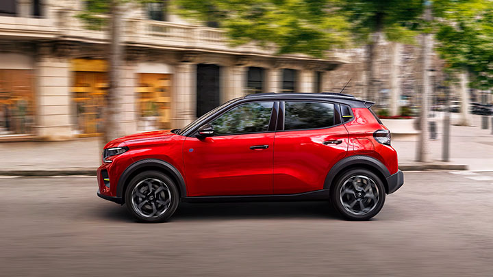 Red Citroen C3 Side Driving