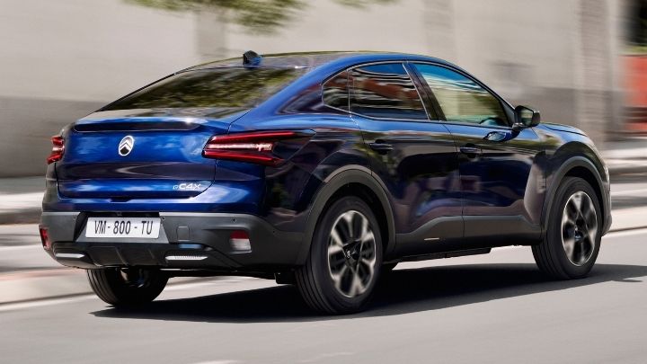 Blue Citroen e-C4 driving on the road