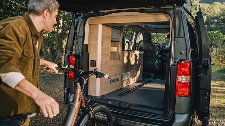 Man Loading His Bike Into Citroen Holdiays