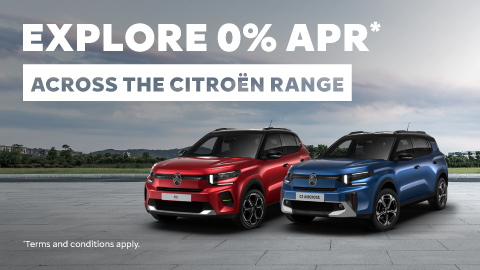 One Blue And One Red Citroen Park Together On Concrete