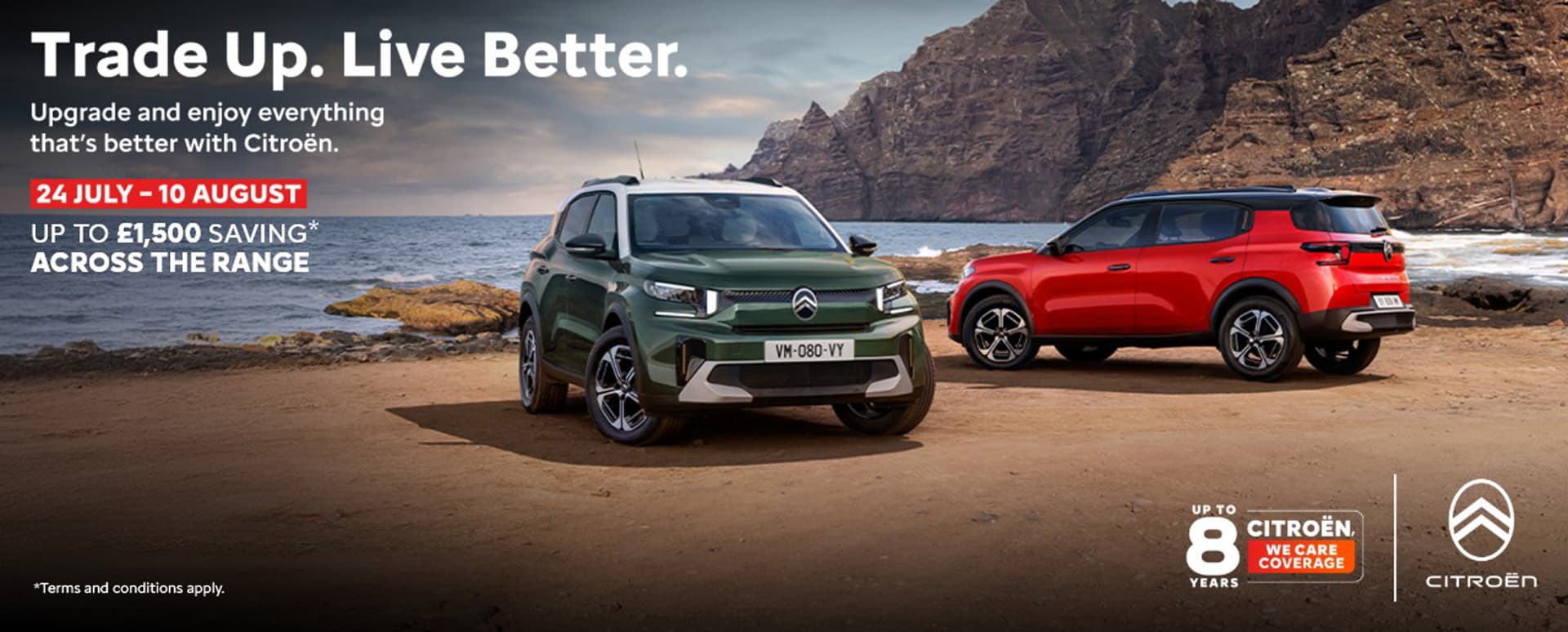 One Green And One Red Citroen Parked On A Beach With Promotional Messaging