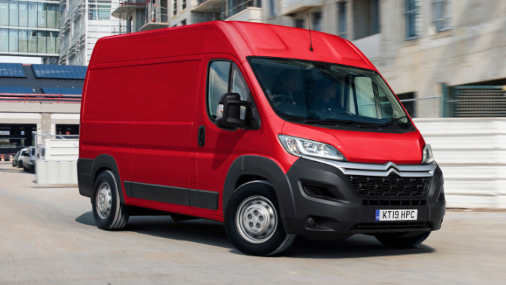 Red Citroen Relay Exterior Front Driving in Urban Area
