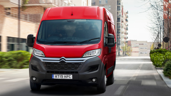Red Citroen Relay Exterior Front Driving in Urban Area