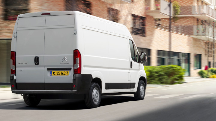 White Citroen Relay Exterior Rear Driving in Urban Area