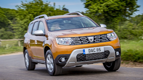 Orange Dacia Duster Exterior Front Driving