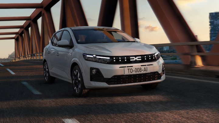 White Dacia Sandero Exterior Front Driving on Bridge