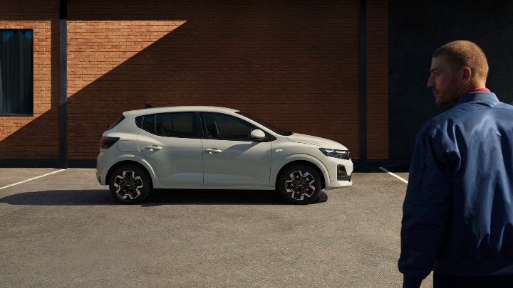 White Dacia Sandero Exterior Side Static with Male