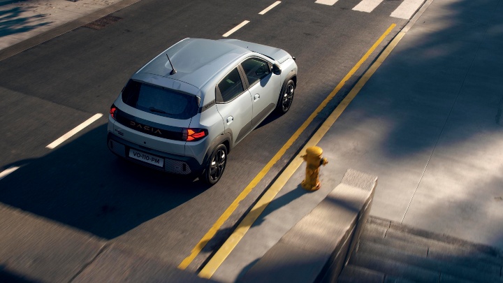 Dacia Spring Aerial rear view on road